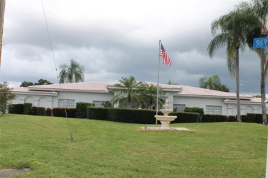 This single-family home, on a corner lot, located in Mainlands on Mainlands Golf Club in Florida - for sale on GolfHomes.com, golf home, golf lot