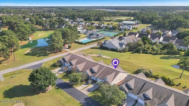 A three-bedroom, two-bathroom townhome located on the par three on South Harbour Golf Links in North Carolina - for sale on GolfHomes.com, golf home, golf lot