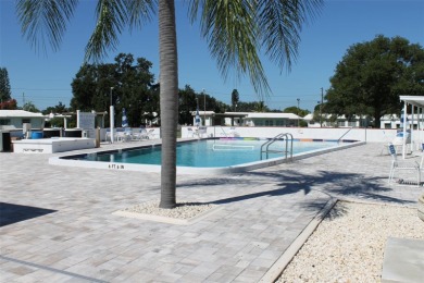 This single-family home, on a corner lot, located in Mainlands on Mainlands Golf Club in Florida - for sale on GolfHomes.com, golf home, golf lot