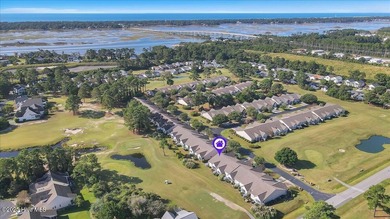 A three-bedroom, two-bathroom townhome located on the par three on South Harbour Golf Links in North Carolina - for sale on GolfHomes.com, golf home, golf lot