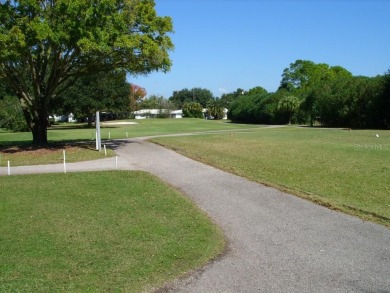 This single-family home, on a corner lot, located in Mainlands on Mainlands Golf Club in Florida - for sale on GolfHomes.com, golf home, golf lot