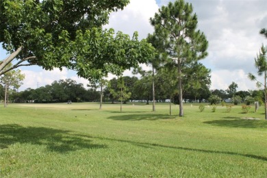 This single-family home, on a corner lot, located in Mainlands on Mainlands Golf Club in Florida - for sale on GolfHomes.com, golf home, golf lot