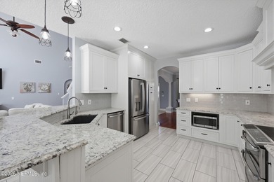 Thoughtfully updated POOL HOME designed for indoor-outdoor on Golf Club At South Hampton in Florida - for sale on GolfHomes.com, golf home, golf lot