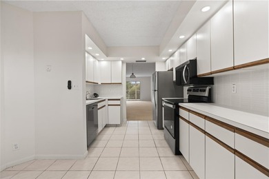 Experience the vibrant, active South Florida lifestyle in this on Wynmoor Golf Course in Florida - for sale on GolfHomes.com, golf home, golf lot