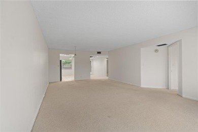 Experience the vibrant, active South Florida lifestyle in this on Wynmoor Golf Course in Florida - for sale on GolfHomes.com, golf home, golf lot