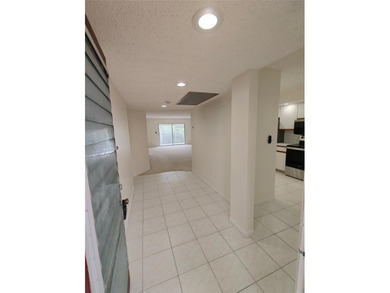 Experience the vibrant, active South Florida lifestyle in this on Wynmoor Golf Course in Florida - for sale on GolfHomes.com, golf home, golf lot