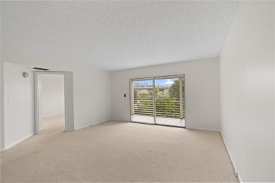 Experience the vibrant, active South Florida lifestyle in this on Wynmoor Golf Course in Florida - for sale on GolfHomes.com, golf home, golf lot