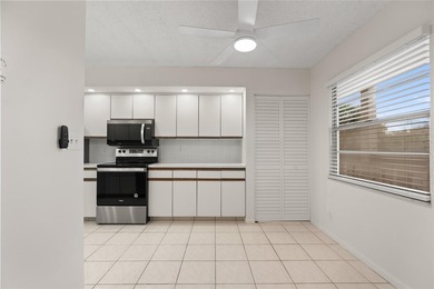 Experience the vibrant, active South Florida lifestyle in this on Wynmoor Golf Course in Florida - for sale on GolfHomes.com, golf home, golf lot