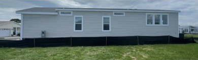 This New Palm Harbor Carriage Farmhouse home is 1500 Sq Ft and on Scotland Yards Golf Club in Florida - for sale on GolfHomes.com, golf home, golf lot