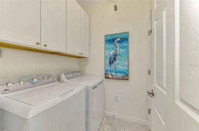 Welcome to 10788 Tarflower Drive! This exceptional second-floor on Sarasota National Golf Club in Florida - for sale on GolfHomes.com, golf home, golf lot