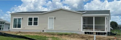 This New Palm Harbor Carriage Farmhouse home is 1500 Sq Ft and on Scotland Yards Golf Club in Florida - for sale on GolfHomes.com, golf home, golf lot