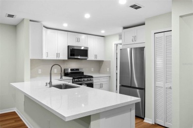Discover the charm and elegance of this beautifully updated home on Arlington Ridge Golf Club in Florida - for sale on GolfHomes.com, golf home, golf lot