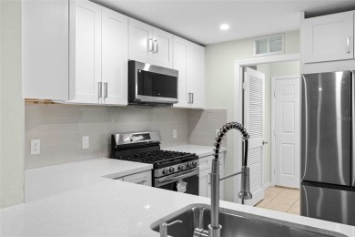 Discover the charm and elegance of this beautifully updated home on Arlington Ridge Golf Club in Florida - for sale on GolfHomes.com, golf home, golf lot