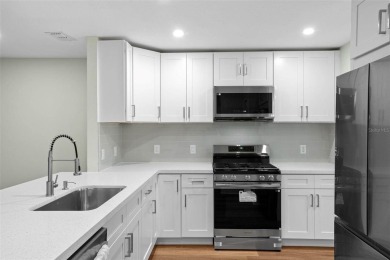 Discover the charm and elegance of this beautifully updated home on Arlington Ridge Golf Club in Florida - for sale on GolfHomes.com, golf home, golf lot