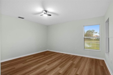Discover the charm and elegance of this beautifully updated home on Arlington Ridge Golf Club in Florida - for sale on GolfHomes.com, golf home, golf lot
