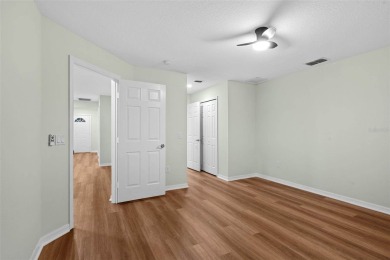 Discover the charm and elegance of this beautifully updated home on Arlington Ridge Golf Club in Florida - for sale on GolfHomes.com, golf home, golf lot