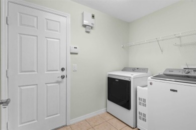 Discover the charm and elegance of this beautifully updated home on Arlington Ridge Golf Club in Florida - for sale on GolfHomes.com, golf home, golf lot