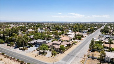 This luxurious single-family residence sits on a .49-acre corner on Painted Desert Golf Club in Nevada - for sale on GolfHomes.com, golf home, golf lot