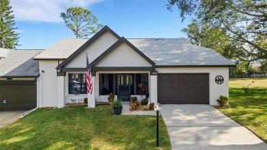 Under contract-accepting backup offers. Casual Coastal elegance on Highland Lakes Executive Golf Course in Florida - for sale on GolfHomes.com, golf home, golf lot