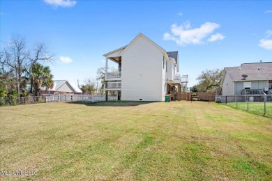 This raised house, perched gracefully on a 1-acre lot, offers an on Pass Christian Isles Golf Club in Mississippi - for sale on GolfHomes.com, golf home, golf lot