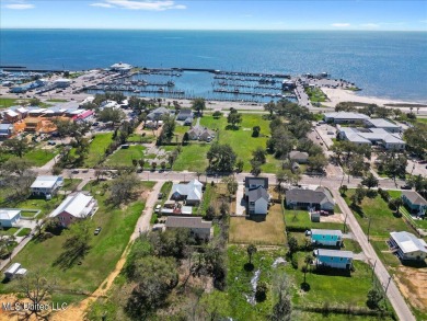 This raised house, perched gracefully on a 1-acre lot, offers an on Pass Christian Isles Golf Club in Mississippi - for sale on GolfHomes.com, golf home, golf lot