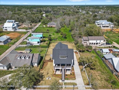 This raised house, perched gracefully on a 1-acre lot, offers an on Pass Christian Isles Golf Club in Mississippi - for sale on GolfHomes.com, golf home, golf lot