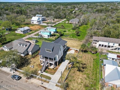 This raised house, perched gracefully on a 1-acre lot, offers an on Pass Christian Isles Golf Club in Mississippi - for sale on GolfHomes.com, golf home, golf lot