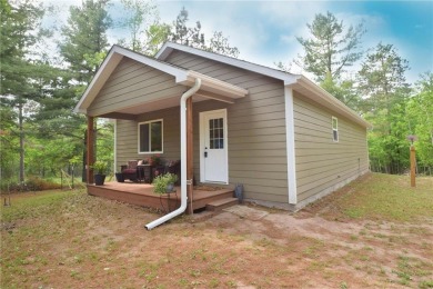 Welcome to your serene Northwoods escape in the heart of Voyager on Voyager Village Country Club - Voyager in Wisconsin - for sale on GolfHomes.com, golf home, golf lot