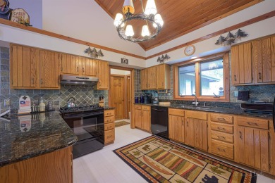 Tucked into the wooded hillside at the end of long ascending on Eagle Ridge Inn and Resort in Illinois - for sale on GolfHomes.com, golf home, golf lot
