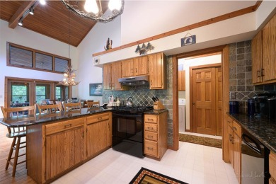 Tucked into the wooded hillside at the end of long ascending on Eagle Ridge Inn and Resort in Illinois - for sale on GolfHomes.com, golf home, golf lot