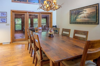 Tucked into the wooded hillside at the end of long ascending on Eagle Ridge Inn and Resort in Illinois - for sale on GolfHomes.com, golf home, golf lot