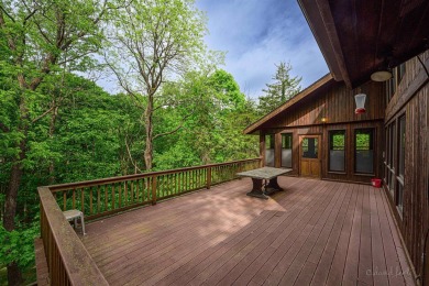 Tucked into the wooded hillside at the end of long ascending on Eagle Ridge Inn and Resort in Illinois - for sale on GolfHomes.com, golf home, golf lot