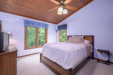 Tucked into the wooded hillside at the end of long ascending on Eagle Ridge Inn and Resort in Illinois - for sale on GolfHomes.com, golf home, golf lot