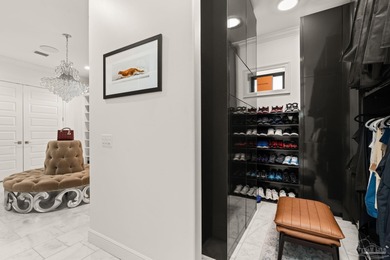 Experience modern coastal elegance in this architecturally on Tiger Point Golf and Country Club in Florida - for sale on GolfHomes.com, golf home, golf lot