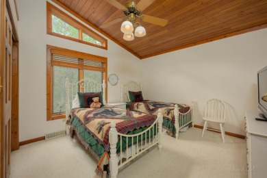 Tucked into the wooded hillside at the end of long ascending on Eagle Ridge Inn and Resort in Illinois - for sale on GolfHomes.com, golf home, golf lot