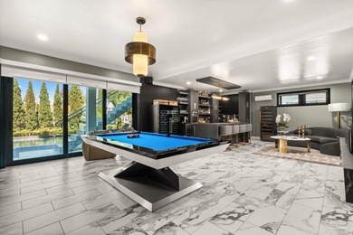 Experience modern coastal elegance in this architecturally on Tiger Point Golf and Country Club in Florida - for sale on GolfHomes.com, golf home, golf lot