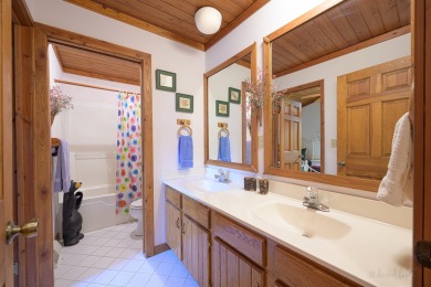Tucked into the wooded hillside at the end of long ascending on Eagle Ridge Inn and Resort in Illinois - for sale on GolfHomes.com, golf home, golf lot