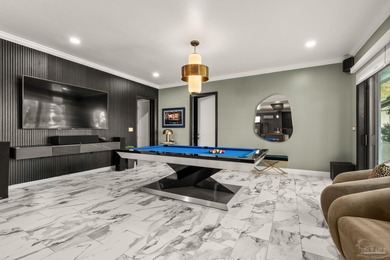 Experience modern coastal elegance in this architecturally on Tiger Point Golf and Country Club in Florida - for sale on GolfHomes.com, golf home, golf lot