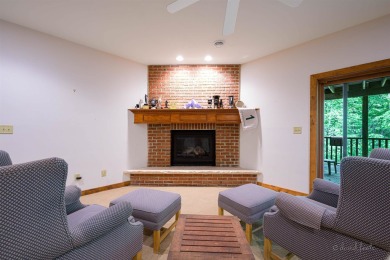 Tucked into the wooded hillside at the end of long ascending on Eagle Ridge Inn and Resort in Illinois - for sale on GolfHomes.com, golf home, golf lot