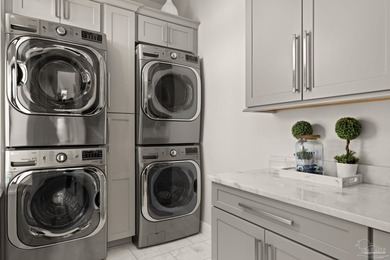 Experience modern coastal elegance in this architecturally on Tiger Point Golf and Country Club in Florida - for sale on GolfHomes.com, golf home, golf lot