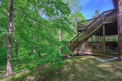 Tucked into the wooded hillside at the end of long ascending on Eagle Ridge Inn and Resort in Illinois - for sale on GolfHomes.com, golf home, golf lot
