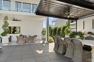 Experience modern coastal elegance in this architecturally on Tiger Point Golf and Country Club in Florida - for sale on GolfHomes.com, golf home, golf lot