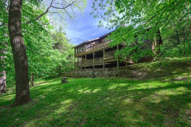 Tucked into the wooded hillside at the end of long ascending on Eagle Ridge Inn and Resort in Illinois - for sale on GolfHomes.com, golf home, golf lot