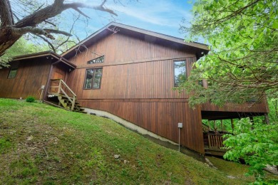 Tucked into the wooded hillside at the end of long ascending on Eagle Ridge Inn and Resort in Illinois - for sale on GolfHomes.com, golf home, golf lot