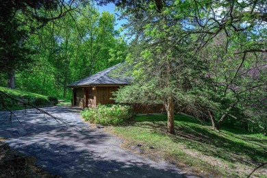 Tucked into the wooded hillside at the end of long ascending on Eagle Ridge Inn and Resort in Illinois - for sale on GolfHomes.com, golf home, golf lot