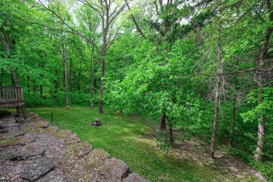 Tucked into the wooded hillside at the end of long ascending on Eagle Ridge Inn and Resort in Illinois - for sale on GolfHomes.com, golf home, golf lot