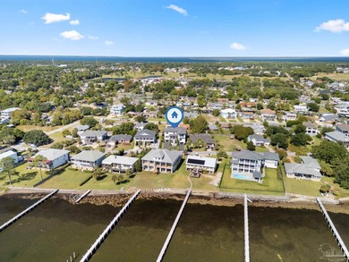 Experience modern coastal elegance in this architecturally on Tiger Point Golf and Country Club in Florida - for sale on GolfHomes.com, golf home, golf lot