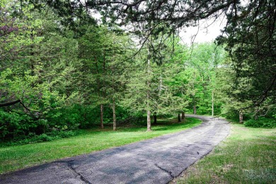 Tucked into the wooded hillside at the end of long ascending on Eagle Ridge Inn and Resort in Illinois - for sale on GolfHomes.com, golf home, golf lot