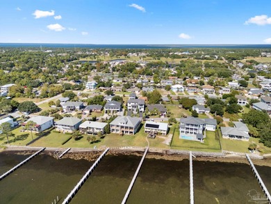 Experience modern coastal elegance in this architecturally on Tiger Point Golf and Country Club in Florida - for sale on GolfHomes.com, golf home, golf lot