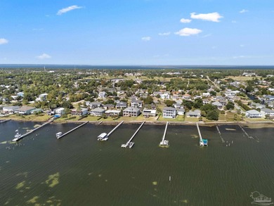 Experience modern coastal elegance in this architecturally on Tiger Point Golf and Country Club in Florida - for sale on GolfHomes.com, golf home, golf lot